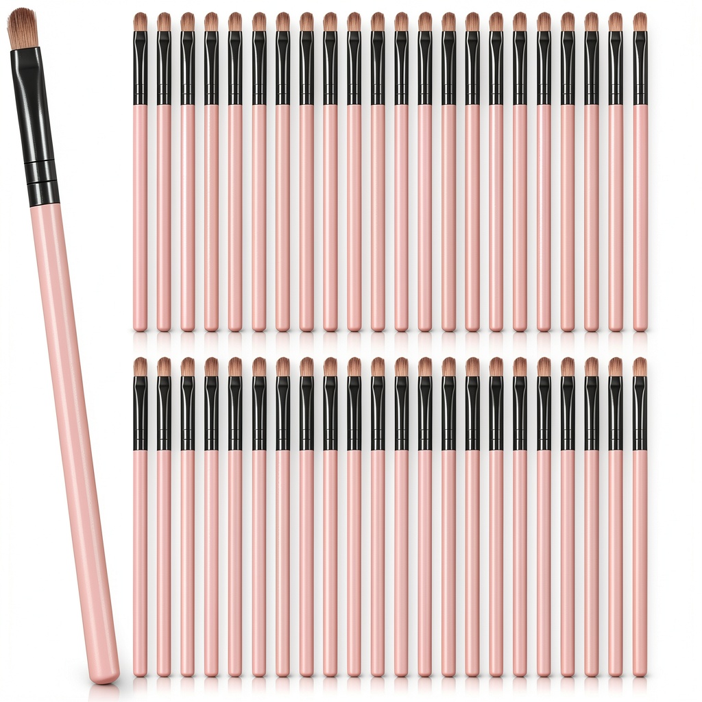 Compact pink synthetic makeup brushes laid out on a vanity table